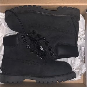 Black timberlands, a size 10 in children.